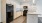 Well-lit kitchen with black appliances in apartments at Avondale Hills