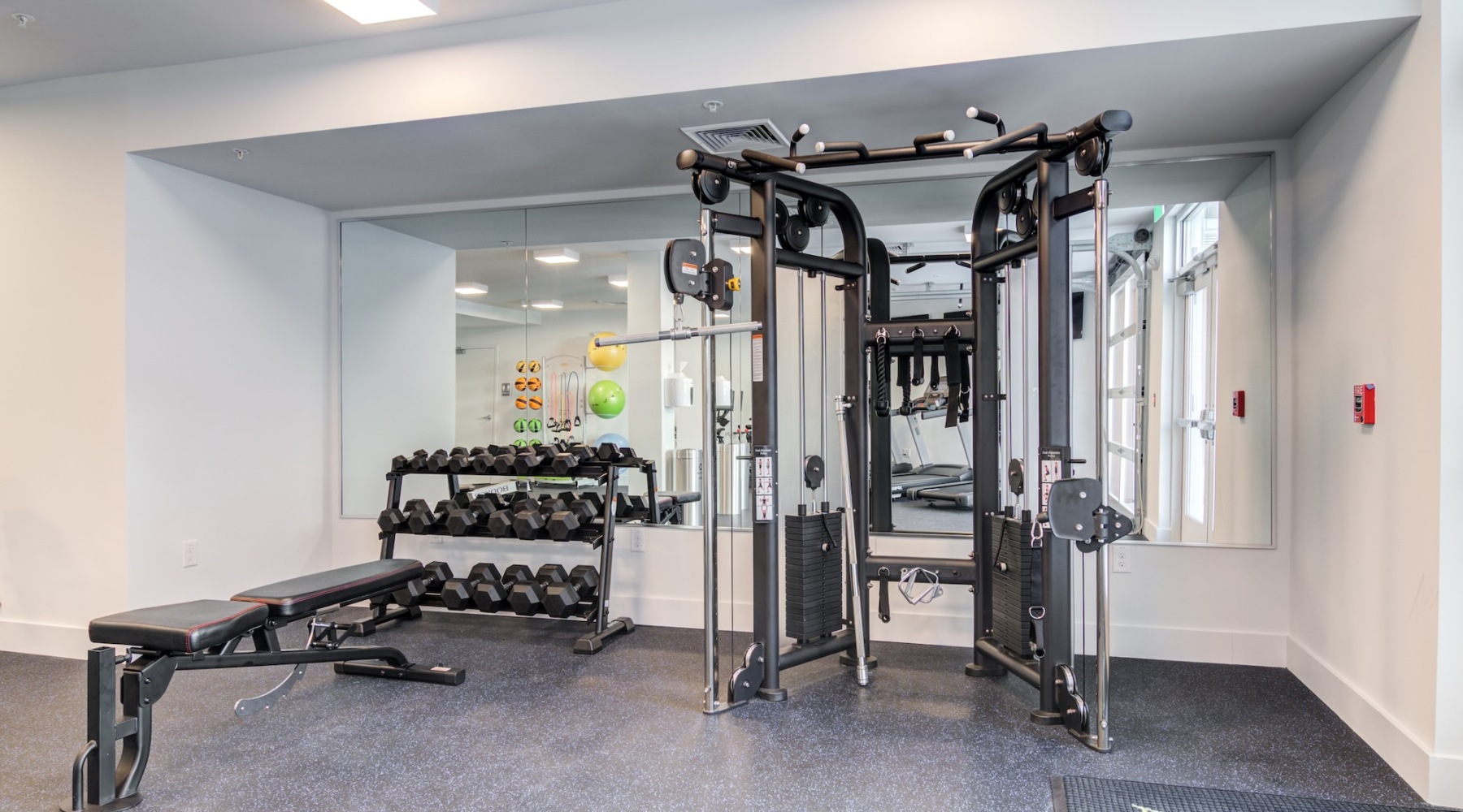 a room with a few treadmills and a treadmill