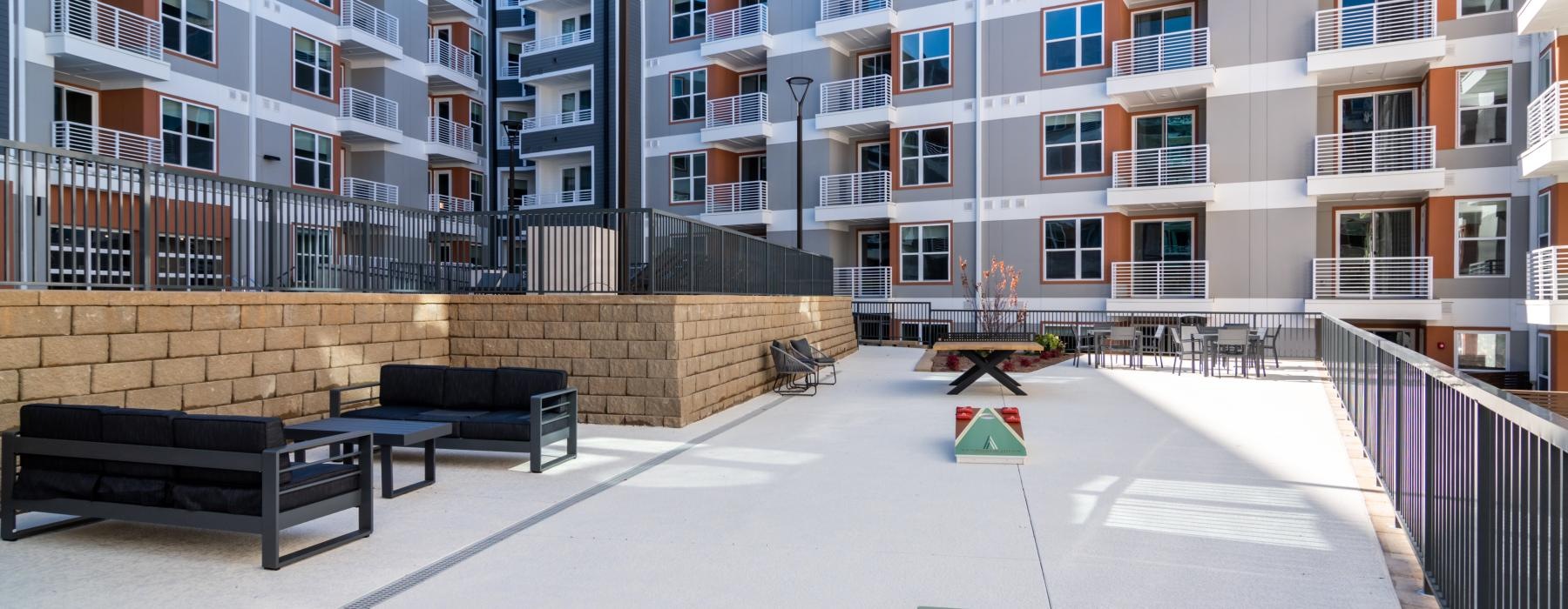 a courtyard with benches and tables