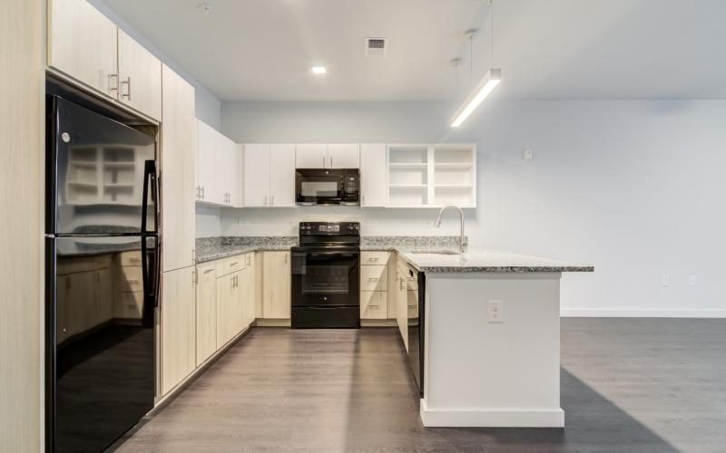 a kitchen with white cabinets