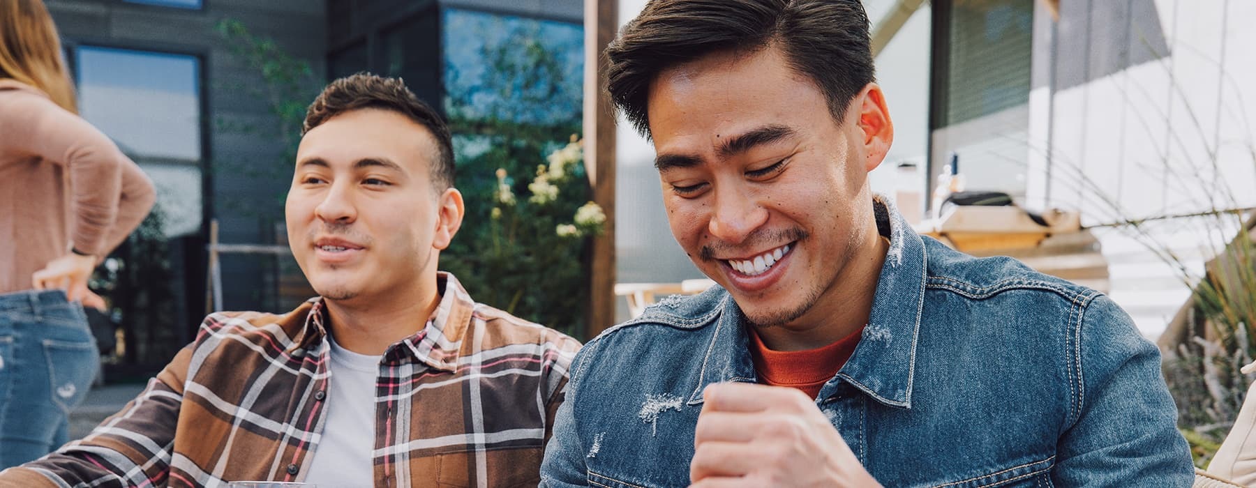 lifestyle image of two men smiling outdoors