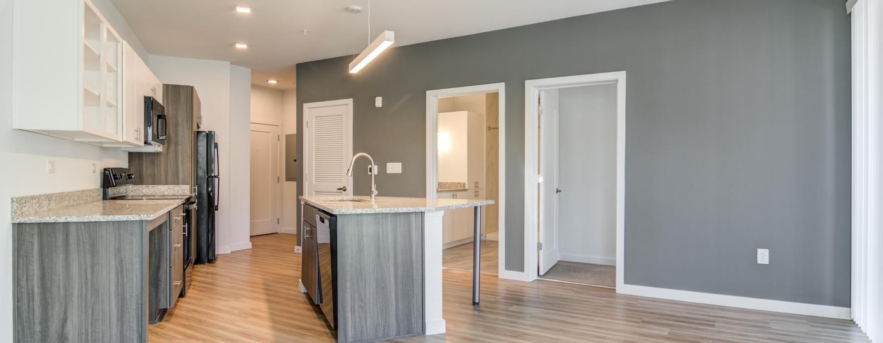 a kitchen with a wood floor